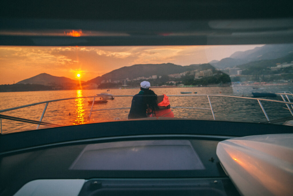 honeymoon couple travel on yacht. Back view. Montenegro